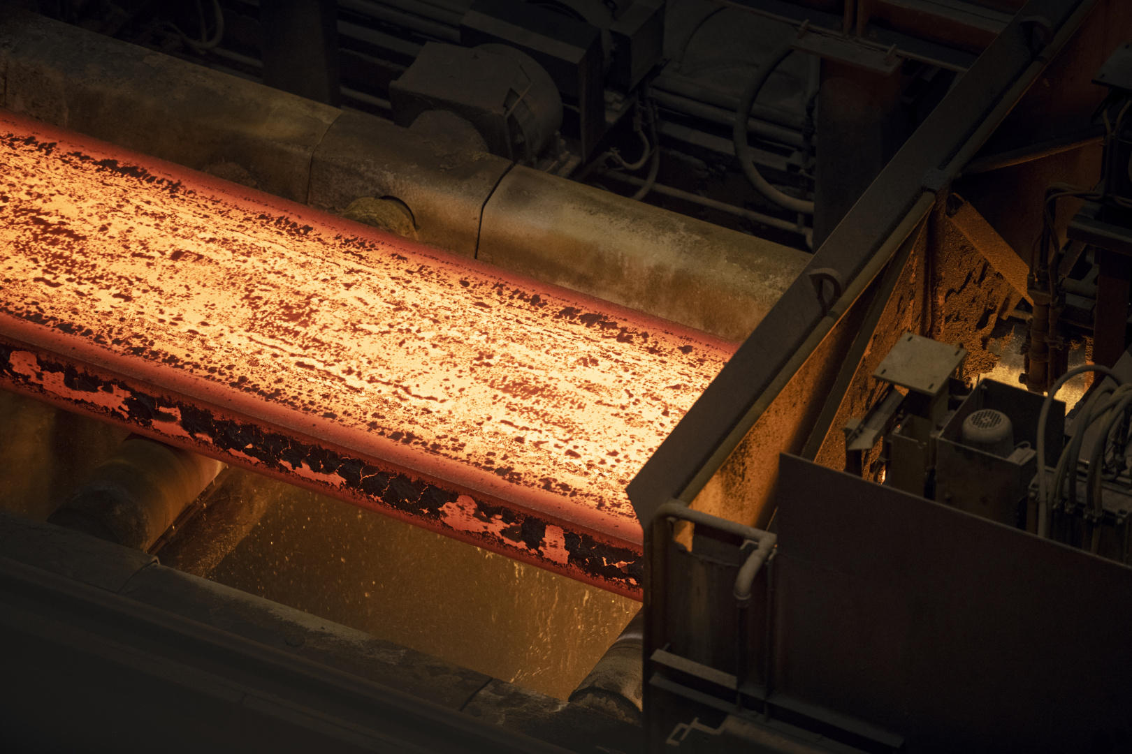Hot steel moving through a rolling mill